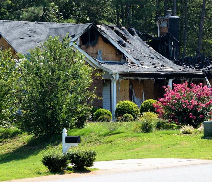 burned hole in roof of house